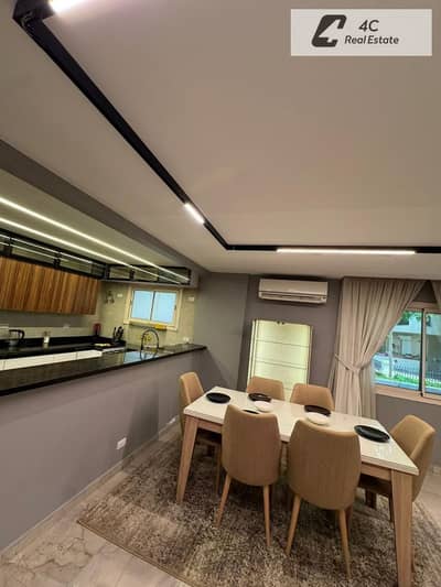 Apartment for sale, fully finished with air conditioning and kitchen, at a price lower than the company's price, in Taj City Compound,