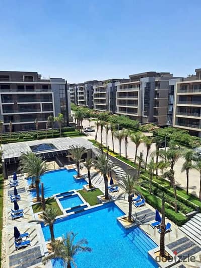 Ready for viewing, a fully sea-facing apartment for sale in Al Patio Oro Compound - Fifth Settlement, a prime location directly on 90th Street with a