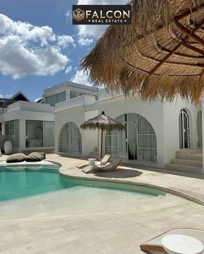 Ground floor chalet with garden for sale (finished with air conditioning and kitchen) by Hassan Allam, with a coastal view on the Red Sea