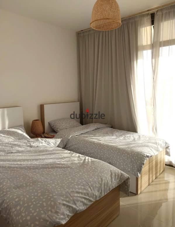 For quick sale, a ground floor chalet with a private garden divided into 3bedrooms in Ain Sokhna, La Vista Ray Village