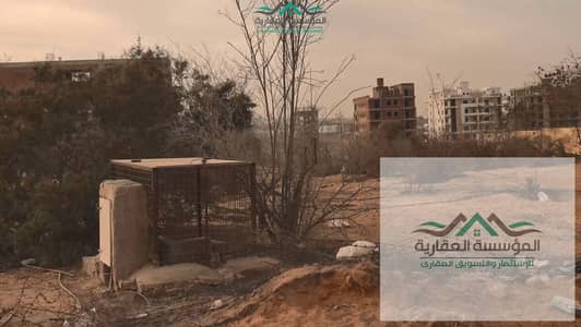 ارض للبيع في الثورة الخضراء مقننة وخالصة مع الجهاز