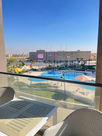 Hotel-style duplex for monthly rent in a prime location in Porto New Cairo, Fifth Settlement, opposite Mivida Street and 90th Street.