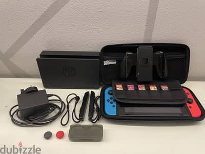 nintendo switch barely used + 5 games