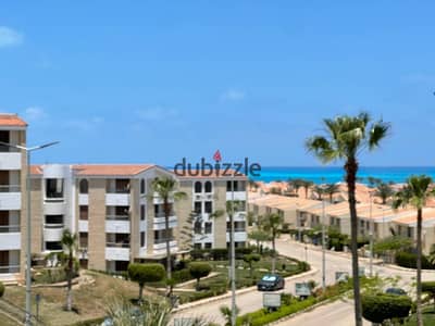 For rent, an apartment with a full view of the sea in Diamond Beach Village, North Coast, kilometer 90 and a half, Al-Ahly Bank Village, clear view of the sea, consisting of 3 rooms, 2 bathrooms, and 2 air-conditioned rooms, close to all services. Details and prices are in the description for rent from the owner, an apartment in Diamond Beach Village, North Coast.