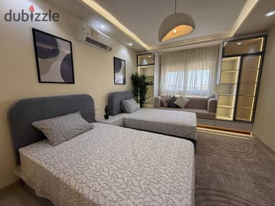 Furnished apartment for rent in Al-Rehab 2, super lux furniture, and at a bargain price of 33,000