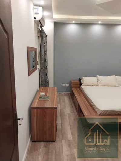 For rent furnished in Al-Rehab 1 - Group 42 | Ground floor with garden, 2 bedrooms, 1 bathroom, modern classy furniture, ready to move in immediately in a prime location close to all services.