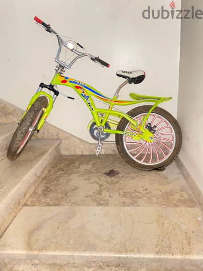 عجله خضراء اللون phoenix BMX جديده من سن ٧ ل١٤ سنه