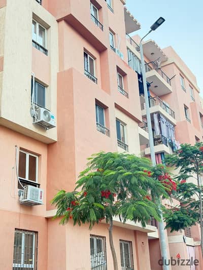 Apartment for sale with mortgage financing overlooking a garden and a main street in the distinguished housing of New Obour, Al-Zohour neighborhood
