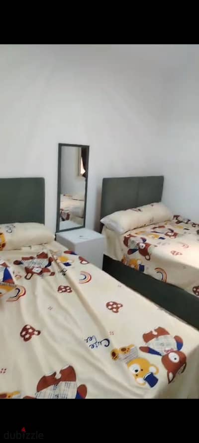Bavaria Circle First Residence, furnished apartment for rent consisting of two bedrooms, reception, bathroom, and kitchen, 11th floor, fully air-conditioned.