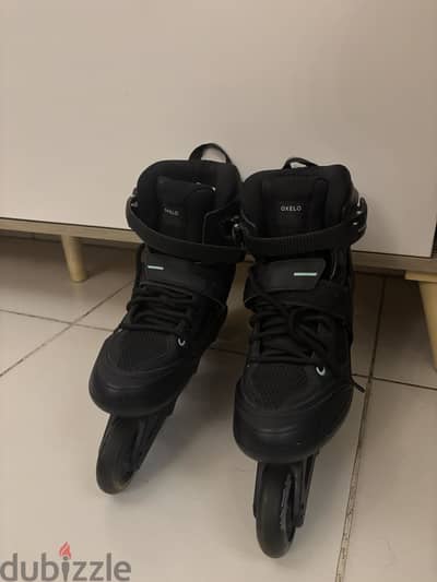 oxelo black adult skates size (39/40) unisex