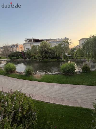 Fully Finished Prime Location open view dirctely on lake and landscape Ready to move Town house for sale at compound Mountain View Hyde park New Cairo