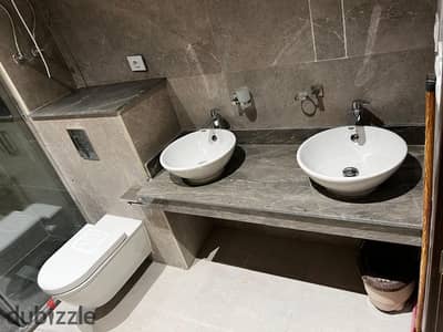 A fully furnished 211-square-meter apartment in Zed Compound, Sheikh Zayed. Prime location near Zayed Dunes Compound and The Address Compound