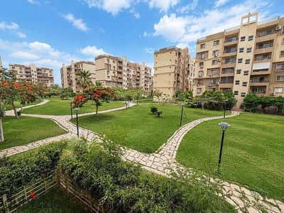 Apartment for rent under the law in Madinty 103 square meters 3 bedrooms and 2 bathrooms wide garden view in the distinctive B6 area directly on services and the second park