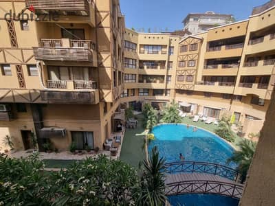 Furnished apartment for rent in Sarayat Al-Maadi, 3 air-conditioned rooms with a shared swimming pool