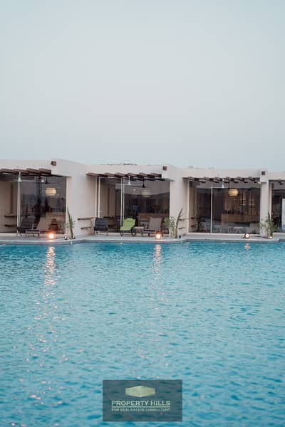 For sale, a chalet by the sea, furnished and equipped, in Gaia, Ras Al Hikma, North Coast, clear marine