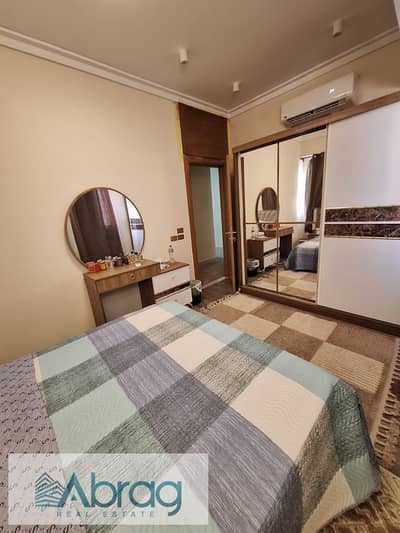 Two-bedroom apartment for sale, fully furnished with appliances and air conditioning, in Dreamland, 6th of October City.