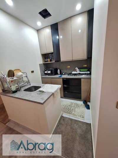 Two-bedroom apartment for sale, fully furnished with appliances and air conditioning, in Dreamland, 6th of October City.