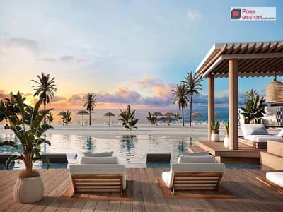 Fully finished chalet, first row on the sea, for sale in Cali Coast North Coast village, in the most distinguished location in Ras El Hekma.