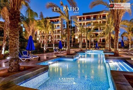 A fully finished 3-bedroom apartment for sale in the Al Patio Oro compound, developed by La Vista, in a prime location in New Cairo.