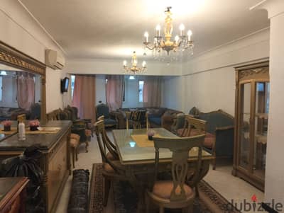 A furnished 150 sqm apartment with full hotel furnishings, fully air-conditioned, for annual rent for a family, newlyweds, or a company. It has 3 bedrooms, a reception area with 3 pieces, a kitchen, and 2 bathrooms. Located on the fifth floor in Alexandria, Al-Ajami, kilometer 21, above Fatahallah Market, in a very prime location.