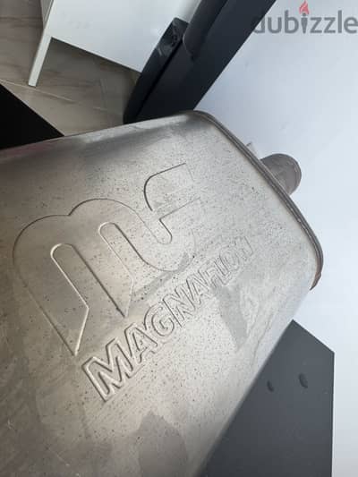 Magnaflow rear muffler with 2 original Akrapovič exhaust tips.