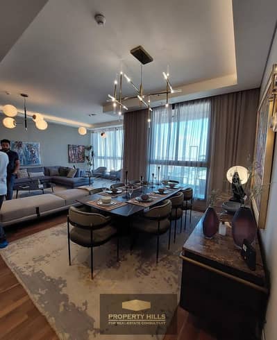 At a bargain price, a ready-to-move-in apartment, fully finished with air conditioning and kitchen in Ayoon Towers, behind Mall of Arabia.