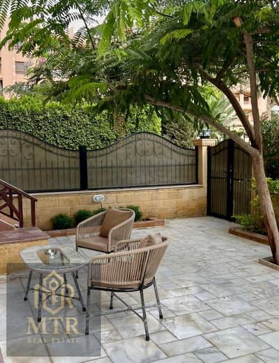 **Furnished apartment for rent in Al Rehab, featuring a private garden, high-end custom finishes, and an exceptional location in Phase 5. **