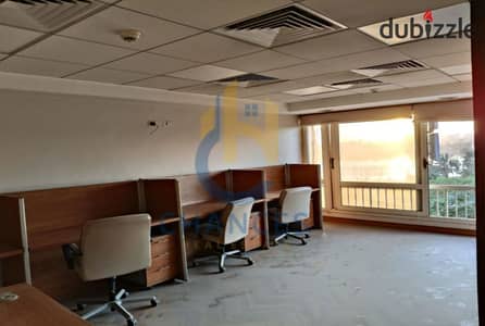 Apartment for sale in Al Qanounyeen Tower on Maadi Corniche, suitable for residential and administrative use, with a Nile view.