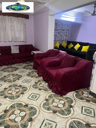 Furnished apartment for rent in Hadayek Al Maadi, Hassanain Desouki Street, close to the metro station. It consists of two bedrooms, a reception area, a bathroom, and a kitchen. Second floor, stairs.
