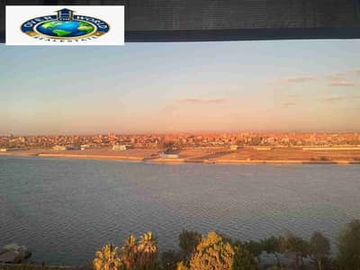A furnished hotel studio on the Nile for rent, fully air-conditioned, with Wi-Fi and natural gas, consisting of a bedroom, living room, bathroom, kitchen, reception, and terrace with a view of the Nile from all sides, Ninth floor, elevator, Corniche El Maadi, Torra