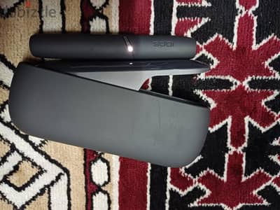 . IQOS 3 DUO tobacco heating device in a BLACK color.