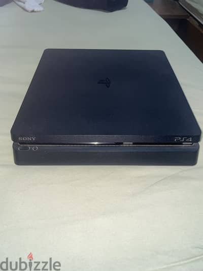 PS4 slim used like new with games and ps4 and with original controller
