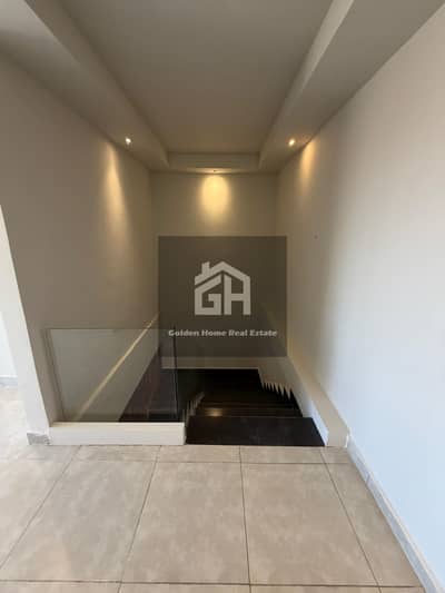 Duplex for rent with kitchen and air conditioning, view of the balconies in Green 3 Compound - Sheikh Zayed