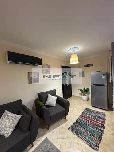 For sale in Madinaty: a 64 sq m studio apartment with 1 bedroom and 1 bathroom, located on the ground floor without a garden. It boasts a prime, vibra