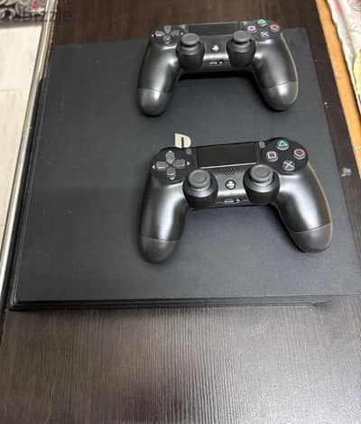 PS4 pro (used) with 2 controllers