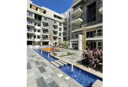 Apartment for sale in a prime location directly overlooking the lagoon in Mountain View iCity, Fifth Settlement, New Cairo, next to Mivida.