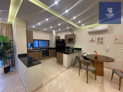 Ground floor apartment for rent with a garden, fully furnished with top-quality hotel-style furniture, in Lake View Residence Compound - Fifth Settlem