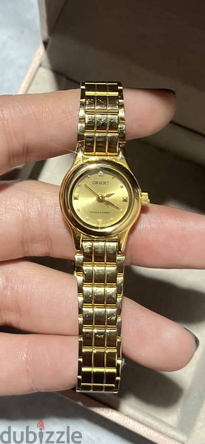 Orient water resistant gold watch made in japan