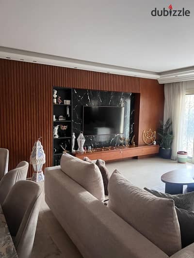 A fully finished, 3-bedroom apartment with a garden and kitchen is for sale in Rehab City, ready for immediate occupancy. The city is fully serviced a