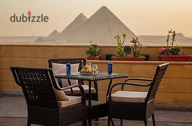 Opportunity: Roof + Outdoor Area with Pyramids View  For sale at a very special price Located in a premium compound next to the Grand Egyptian Museum