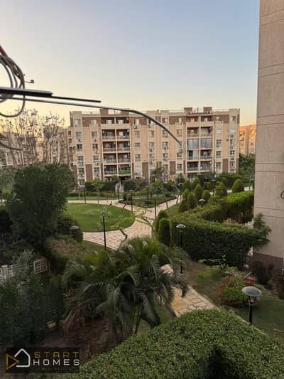 Distinctive 96 m² two-bedroom apartment for sale in Madinaty (B7); features a "double view" overlooking both the garden and the park, and an American-