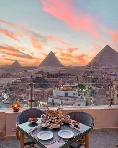 Dollar investment studio for sale with a view of the Pyramids and the Grand Egyptian Museum with a down payment of 855 thousand and a building ready for inspection