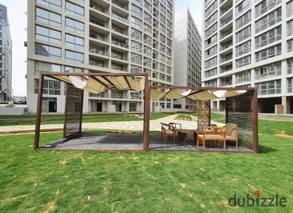 Apartment for sale in compound One Katameya 125 m half finishing facing the swimming pool