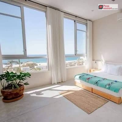 شالية للبيع بخصم 30% علي اللاجون وفيو البحر في قرية كالي كوست الساحل الشمالي Cali Coast | تشطيب بالكامل بالقرب من ماونتن فيو راس الحكمة