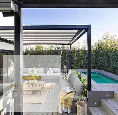 The most luxurious and distinctive corner villa in the Fifth Settlement, with a deposit of 1,723,000, very large area, distinctive division for villas only, water view, just minutes from the American University, next to Patio Town and the Suez Road.