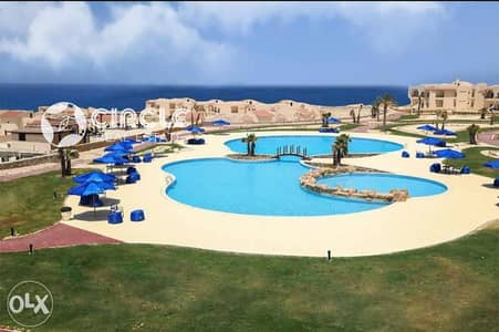 توين هاوس للبيع تشطيب كامل في كمبوند كورال هيلز Coral Hills الساحل الشمالي بمساحة أرض 248 متر