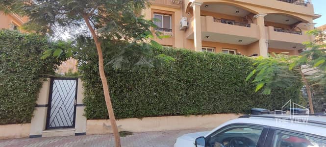Ground floor apartment with a luxurious garden for sale in Al Khamael Compound
