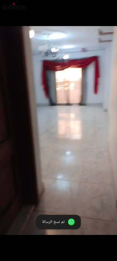 Apartment for rent in Palm City Compound Al-Nakhil on the ring road, Maadi, 135 m, three rooms, two bathrooms, it has a kitchen installed, gas heater, two split air conditioners, curtains, and chandelier. First floor, elevator, natural gas, electricity meter, landline phone, and internet.