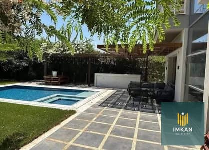 Standalone villa for sale, ready for immediate occupancy and finished, in a compound with installments over 7 years, near Mivida, Fifth Settlement, Ta