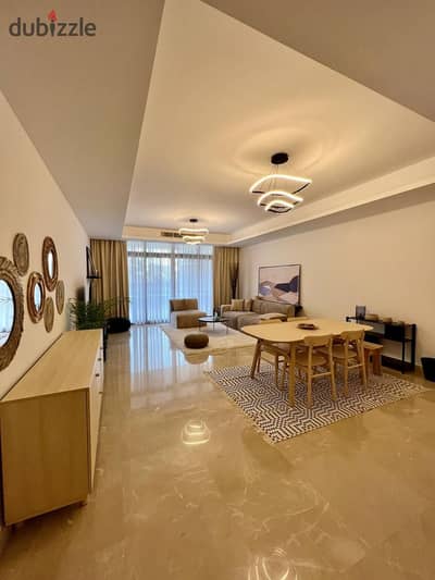 Ground-floor apartment with a garden for sale fully finished and furnished in the CFC Compound, Fifth Settlement.